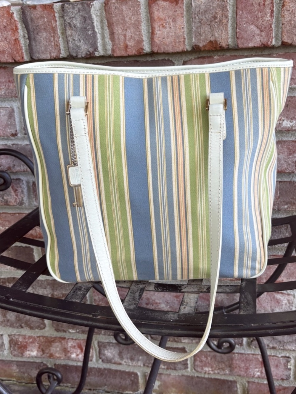 Beautiful vintage striped Fossil hand bag.